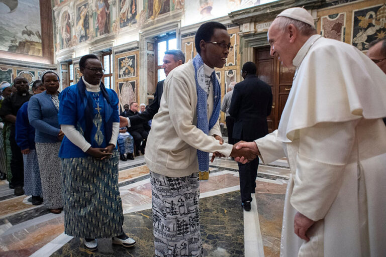 Pope Francis greets a woman during an audience with members of the Missionaries of Africa and the Missionaries of Our Lady of Africa at the Vatican Feb. 8, 2019. (CNS photo/Vatican Media) See POPE-MISSIONARIES-AFRICA Feb. 8, 2019